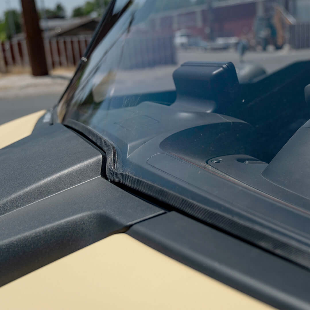 Close-up of Segway UT10 polycarbonate front windshield showcasing clarity and robust design for protection.