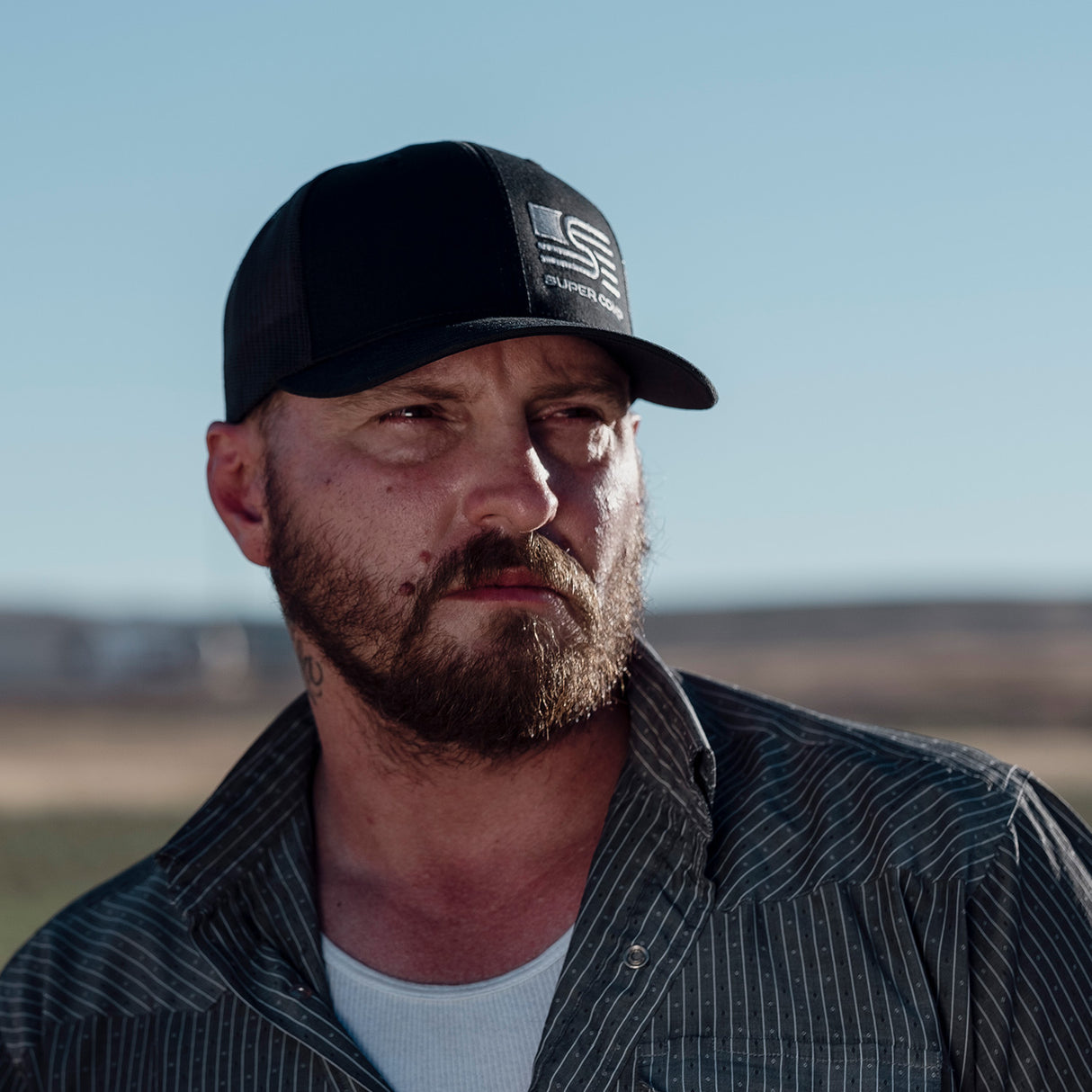 Photo of Classic Black Trucker Cap With Corner Logo by Super Comp USA - Premium Apparel for UTVs / Side by Sides