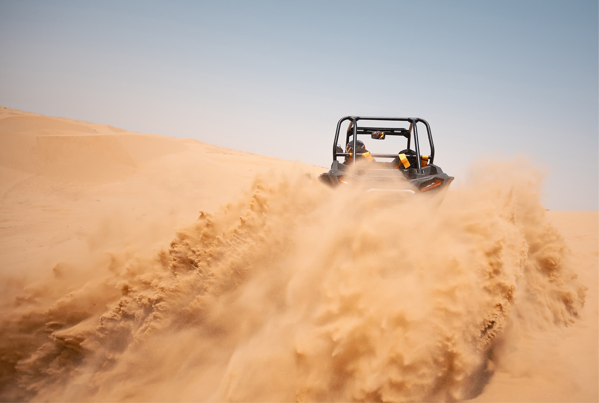 Car riding in sand dunes